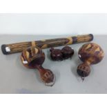 African tribal related items to include a pair of gaude maracas, a rain stick and an oriental carved