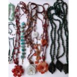 A quantity of modern Oriental jade and hard-stone costume jewellery, mainly necklaces, all housed in