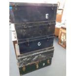 Five trunks to include four black metal examples, one trunk with a Cunard label, A/F, Location: A4E