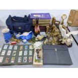 A mixed lot to include brass ornaments, boules set with shoes, cigarette cards, books and other