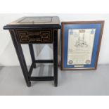 A small black lacquered and gilt wooden table with a drawer and chinoiserie decoration, along with a