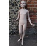 A mid 20th Century mannequin in the form of a young lady with painted face having removable arms, no