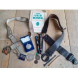 A 1950's Boys Scout leather belt and Cub Scout booklet, a boy's Lone Ranger belt with buckle, 2