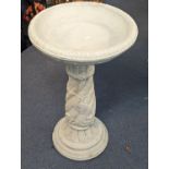 A modern composition stone bird bath, on a scrolled base, stamped Sparta Statues, Location: