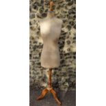 An early to mid 20th Century mannequin/dressmaker's dummy on an adjustable elm stand with the number