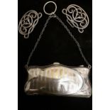 An early 20th Century silver evening bag with metal chain together with a silver buckle, total