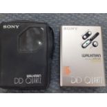 Two retro Sony Walkman's to include the models WM-36 and Wm-DDIII, together with a pair of