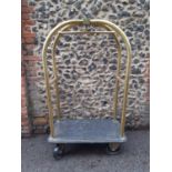 An American Art Deco style full size large hotel birdcage luggage trolley. The trolley having