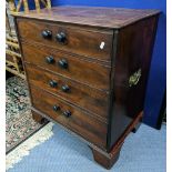 A Georgian mahogany chest of two drawers converted from a commode and having twin brass handles,