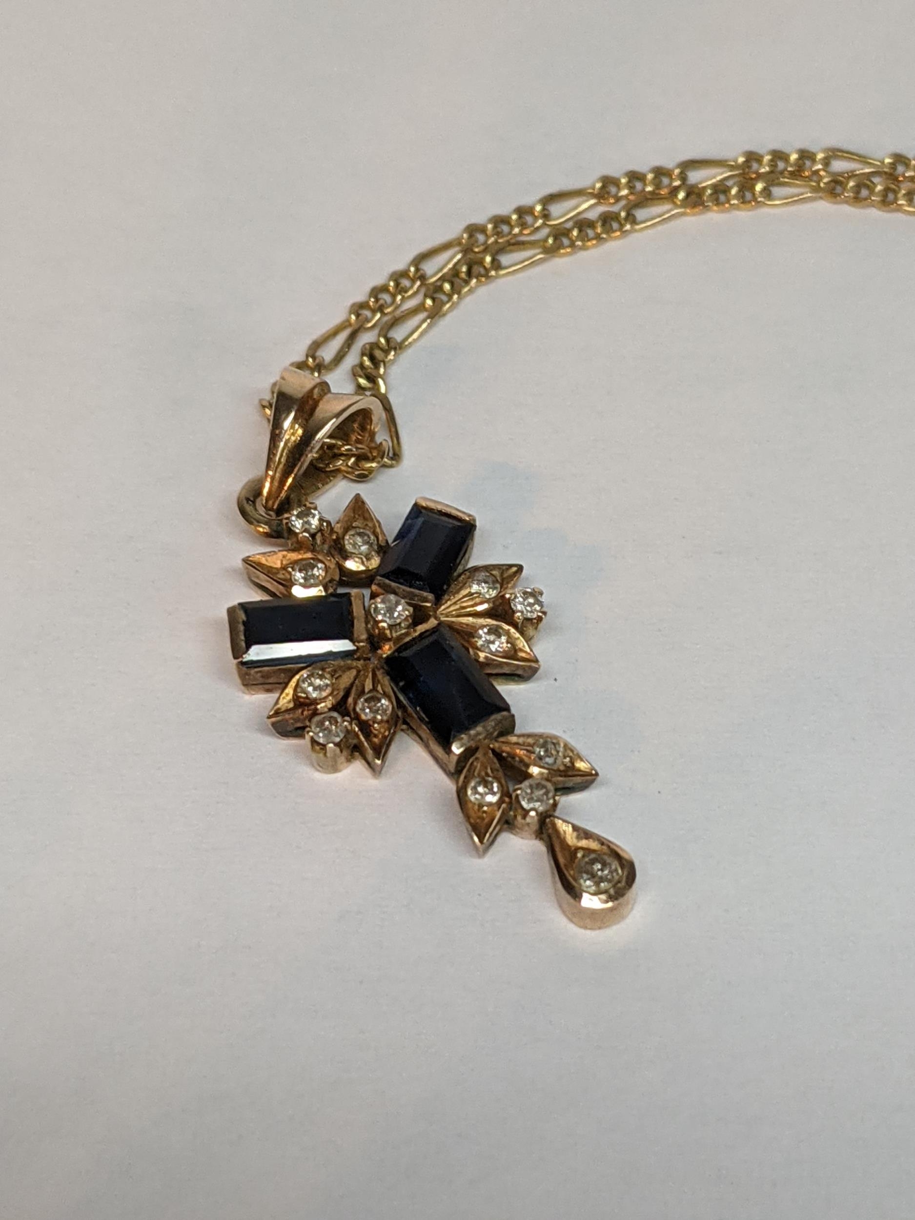 A 9ct gold necklace inset with 14 diamonds and three sapphires, total weight 4.9g Location: - Image 2 of 2