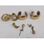 A collection of 9ct and yellow metal earrings to include a pair of 9ct gold hoop earrings, 6.7g A/