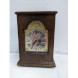 A Charles Frodsham mahogany cased clock, with a silver and brass dial on turned feet Location: