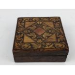 An early 20th century Italian Sorento inlaid olive wood box, the hinged lid decorated with geese and