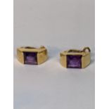 A pair of 18ct yellow gold and amethyst ear clips, total weight 7.2g Location: