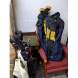 A set of Browning golf club irons, Wilson woods and others in a blue golf bag with a bag of