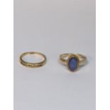 Two 9ct gold rings one inset with diamonds together with one inset with blue cabochon, total