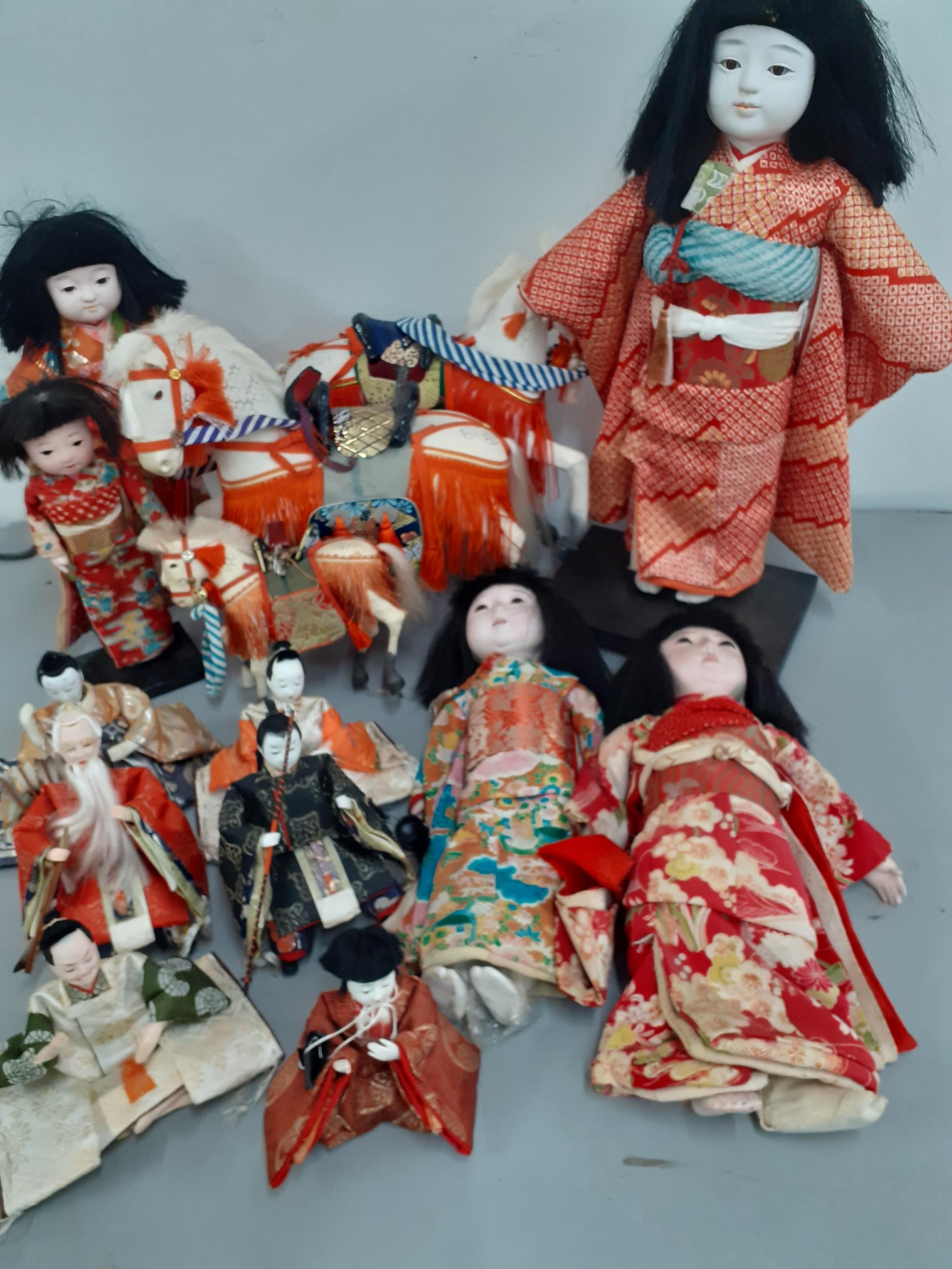 A quantity of mainly 1970's oriental dolls and horses Location: R1:3