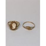 A 9ct gold Karat Craft twist ring, together with a 9ct gold cameo ring, total weight 2.8g Location: