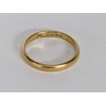 A 22ct gold wedding band, total weight 3.1g Location: