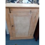 A Victorian pine cabinet with twin panelled doors and red painted doors, 96cm h x 76cm w x 43cm d