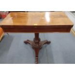 A mid 19th century mahogany fold-over top card table with turned Colum, a tripod base and contents