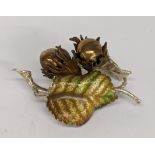 A silver and enamelled ornament of acorns and leaves, signed indistinctly Location:
