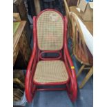 An early 20th century bentwood rocking chair painted in red Location:RAF