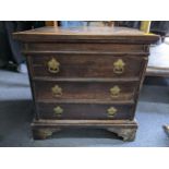 An early 18th century oak commode in the form of a three drawer chest of drawers, 49.5cm h x 49.
