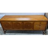 A mid-century Nathan Circles design teak sideboard model 1024, twin cupboard doors flanked by a