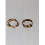 A 9ct gold buckle ring together with a 9ct gold Russian ring, total weight 6.0g Location: