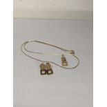 A 14ct gold necklace square drop pendant, together with a pair of square drop earrings Location: