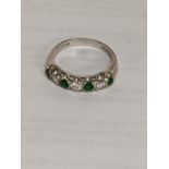 A 18ct gold ring set with diamonds and emeralds, 3.5g Location: