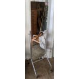 An industrial cheval mirror having chrome supports and on four castors, 155h x 47w, Location: