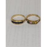 Two gold rings, one stamped 585 set with blue sapphires, together with a 10k stamped ring with