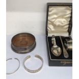 A boxed silver plate Christening set together with two silver bangles, one hallmarked Edinburgh 1980