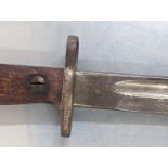 A WWII era Norwegian Kray Jorgensen M1916 bayonet, numbered 25091 and23975 to the scabbard,
