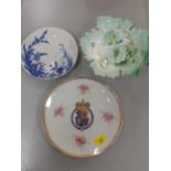 A Chinese armorial plate, a Japanese blue and white plates and a 19th century green dish in the form