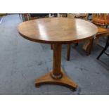 A William IV rosewood occasional table having a circular top and a turned, tapered column, 64.5h x