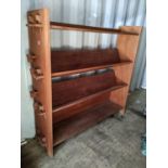 An Arts & Crafts four tier open bookcase having peg jointed sides, 121.5h x 132w, Location: