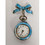 A late 19th/early 20th century silver enamelled fob watch suspended on a matching bow brooch A/F