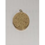 A 9ct gold floral engraved locket pendant, total weight 12.4g Location: