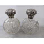 A pair of late 19th/early 20th century silver topped dressing table jars Location: