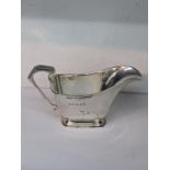 A silver cream jug with an angular handle, total weight 108.9g Location: