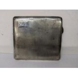 A mid 20th century silver engine turned cigarette case, engraved with initials EM to a corner,