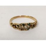 A yellow metal ring inset with pearls and paste green stones, 2.2g Location: