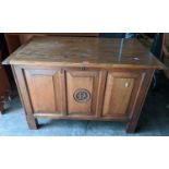 A coffer having a hinged top and the panelled front carved with the initial R, 69h x 103w, Location: