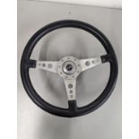 A Moto Lita classic car steering wheel, with central crossed flags motif, Location: