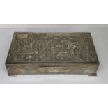 An early/mid 20th century continental cigar box having embossed decoration, stamped sterling