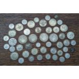 A collection of early/mid 20th century British coinage to include half crowns, florins, shillings,