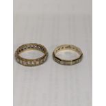 Two 9ct gold eternity rings inset with white sapphires, total weight 7.1g Location: